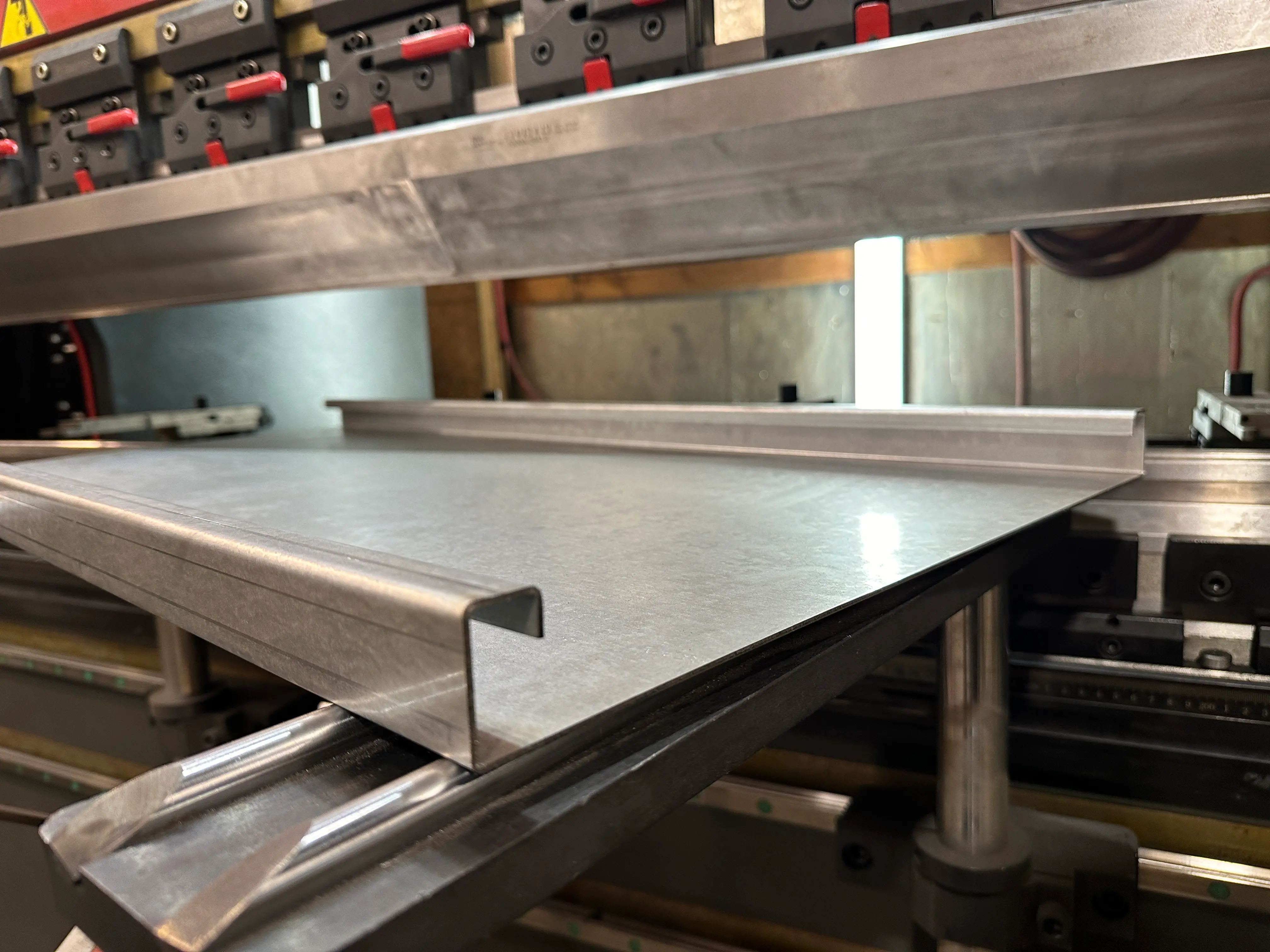 CNC press brake forming sheet metal into precise bends